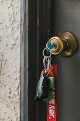a key chain hanging from a door handle