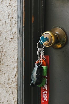 a key chain hanging from a door handle