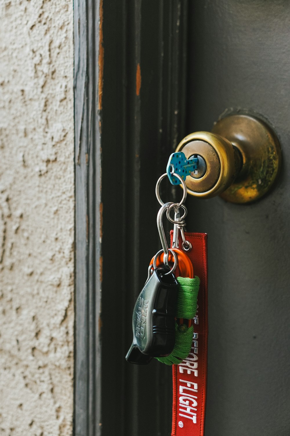 a key chain hanging from a door handle