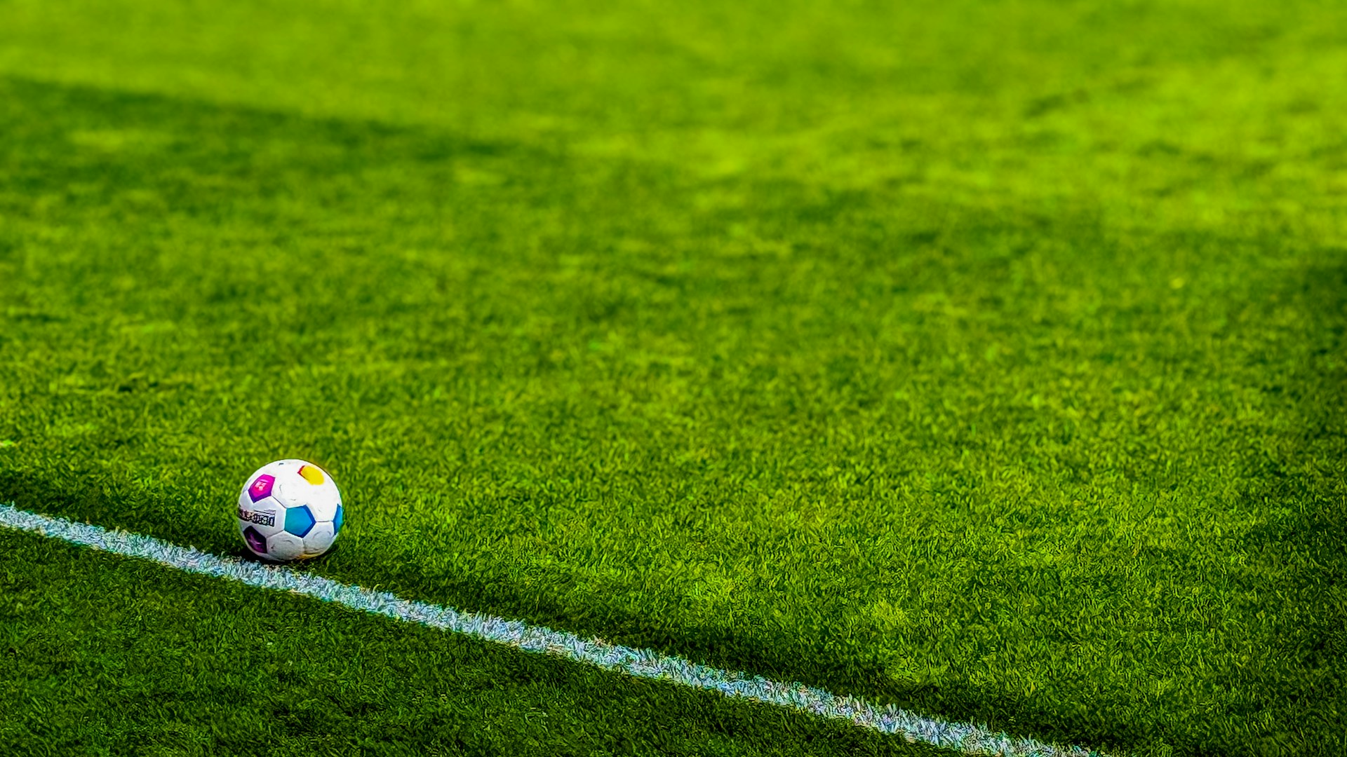 a soccer ball sitting on top of a soccer field