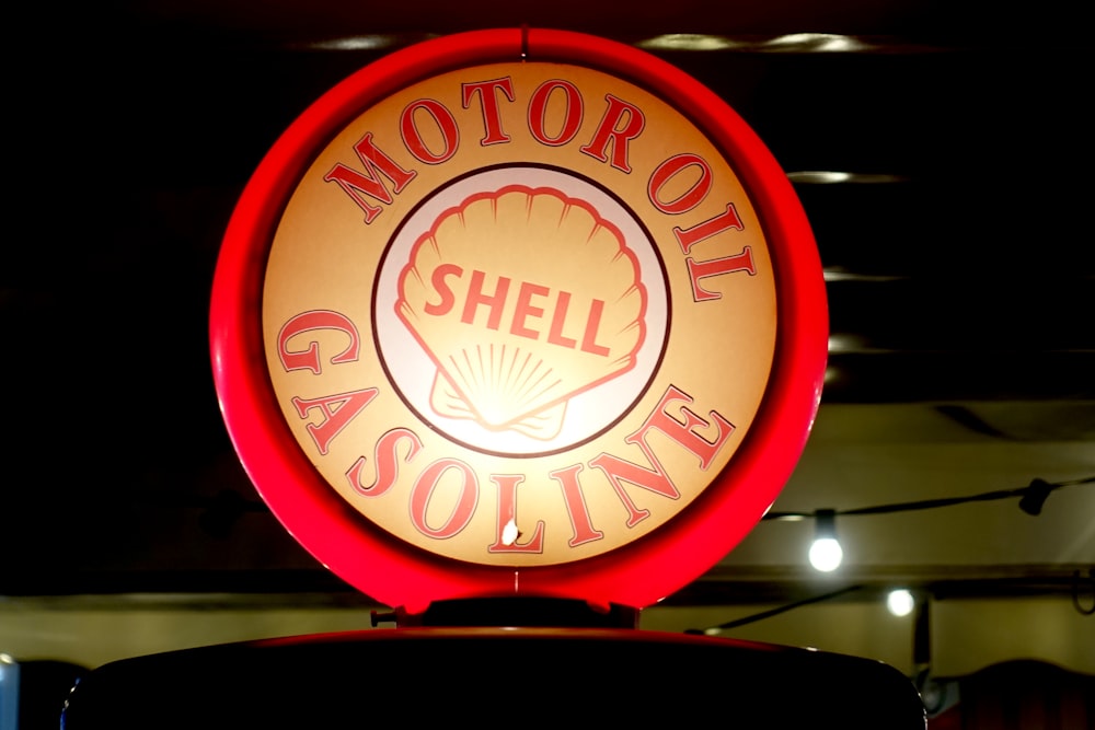 a neon sign for a shell gas station