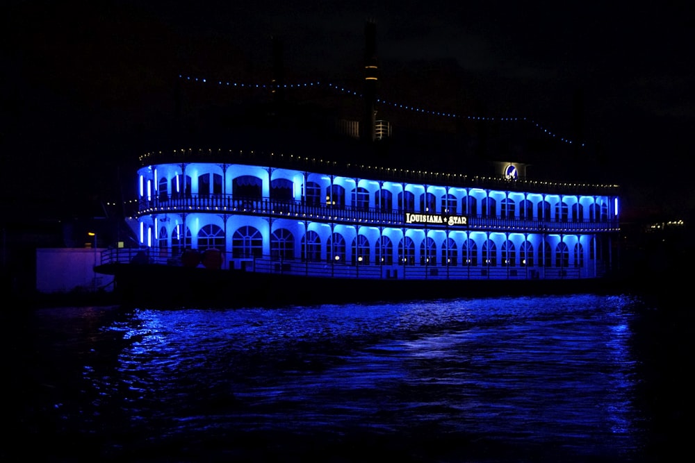 a large building lit up with blue lights