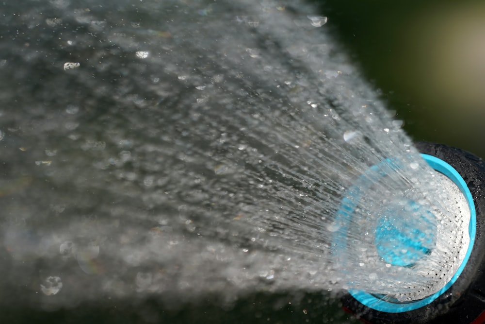 a close up of a water hose spewing water