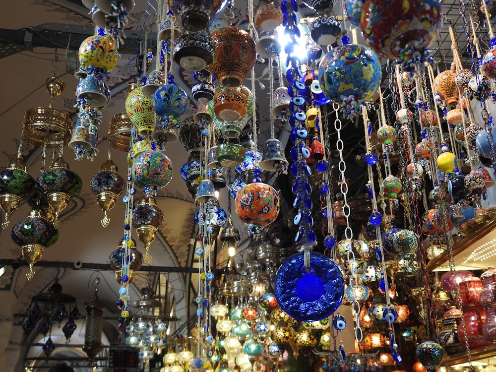 a bunch of glass balls hanging from a ceiling