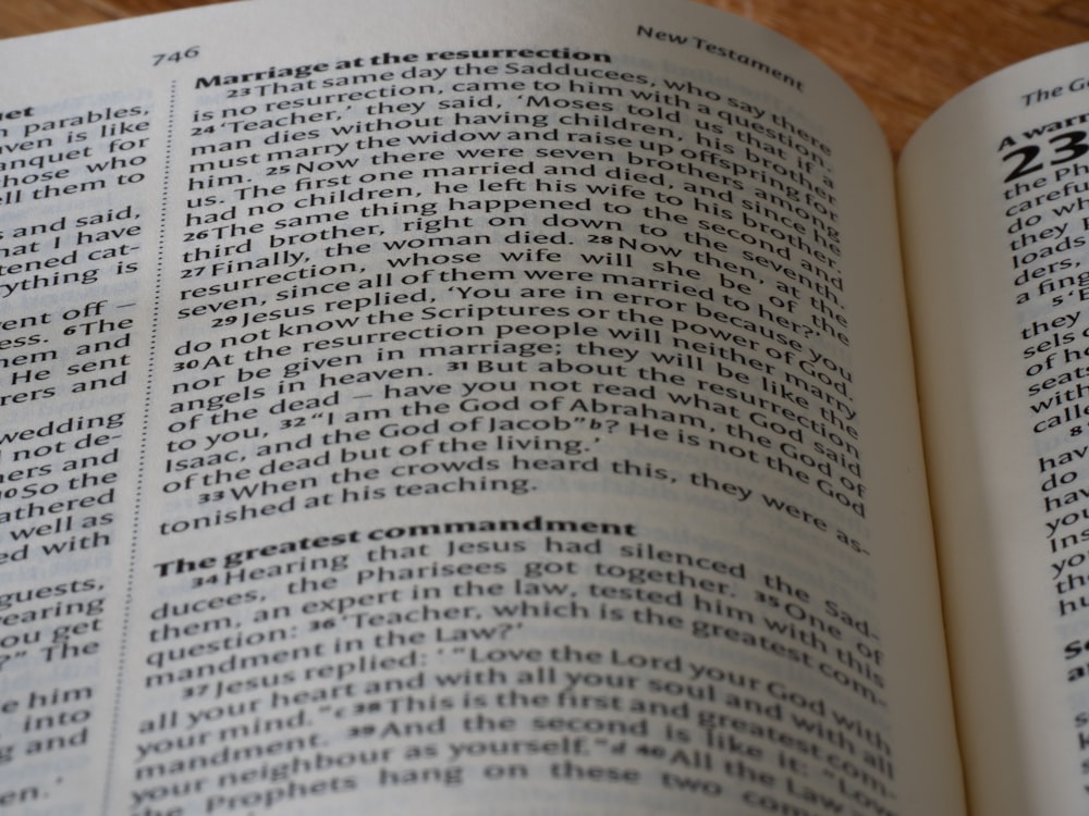 a close up of an open book on a table