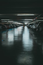 a parking garage filled with lots of parked cars