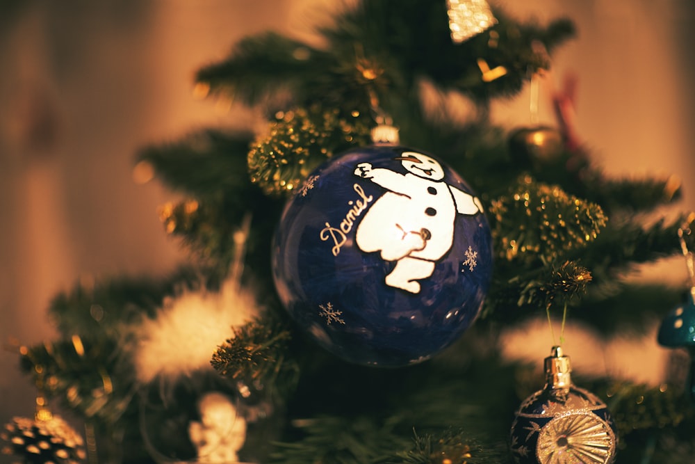 a close up of a christmas tree with ornaments