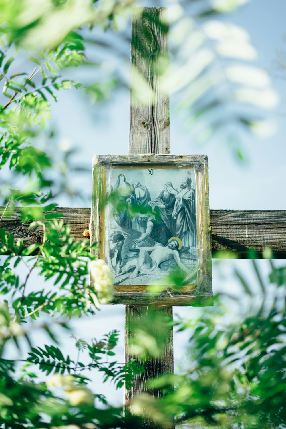 a cross with a picture of jesus on it