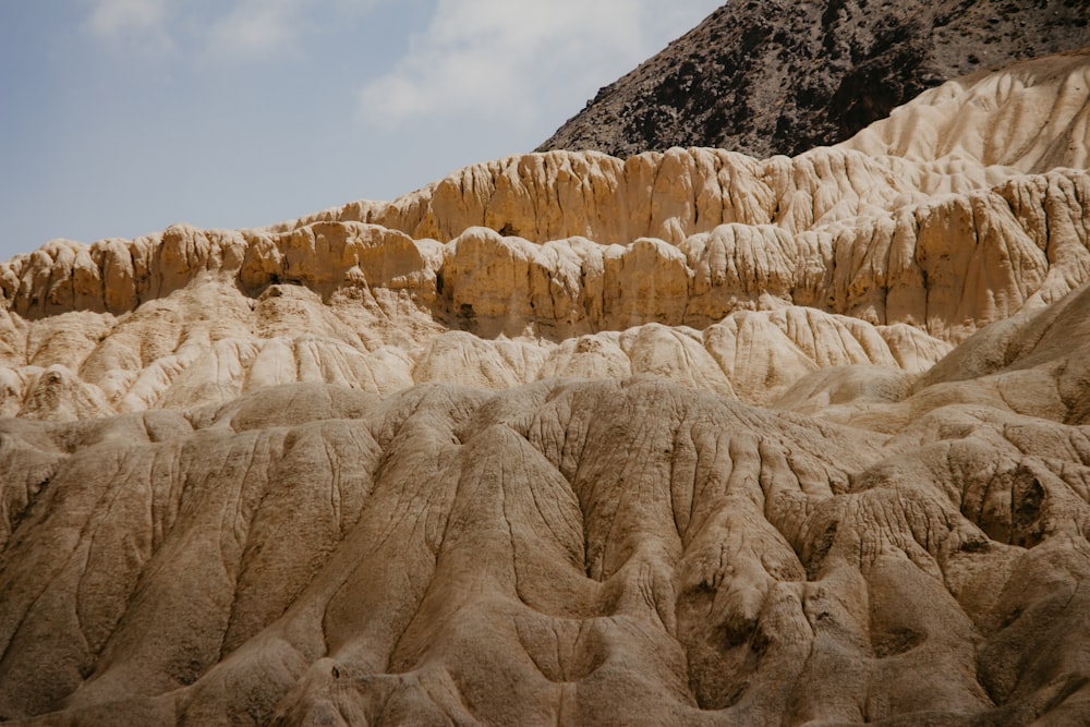 a view of a mountain with a sky in the background