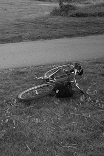 a bicycle that is laying on the ground