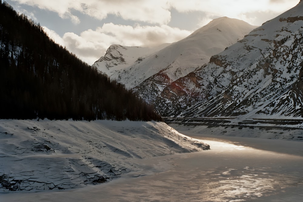 a river running through a snow covered valley