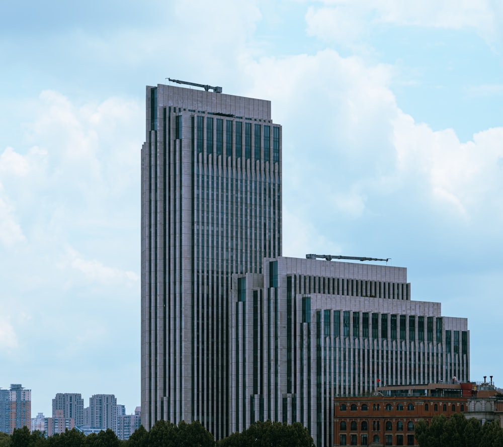 two tall buildings with a sky background