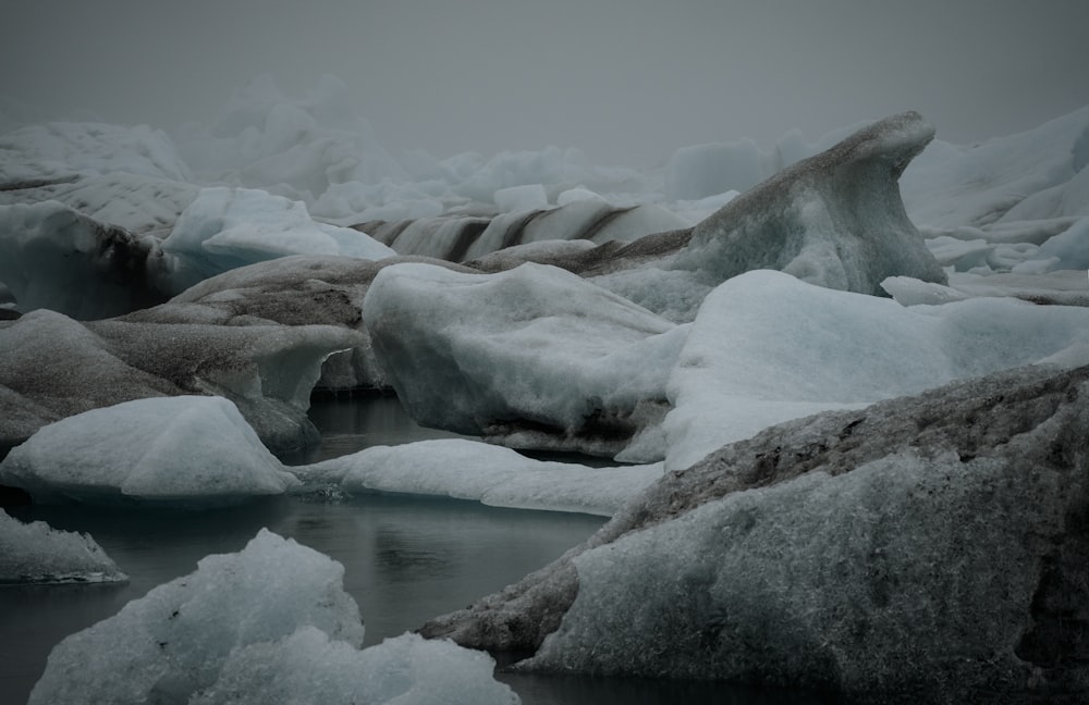 a group of icebergs that are floating in the water