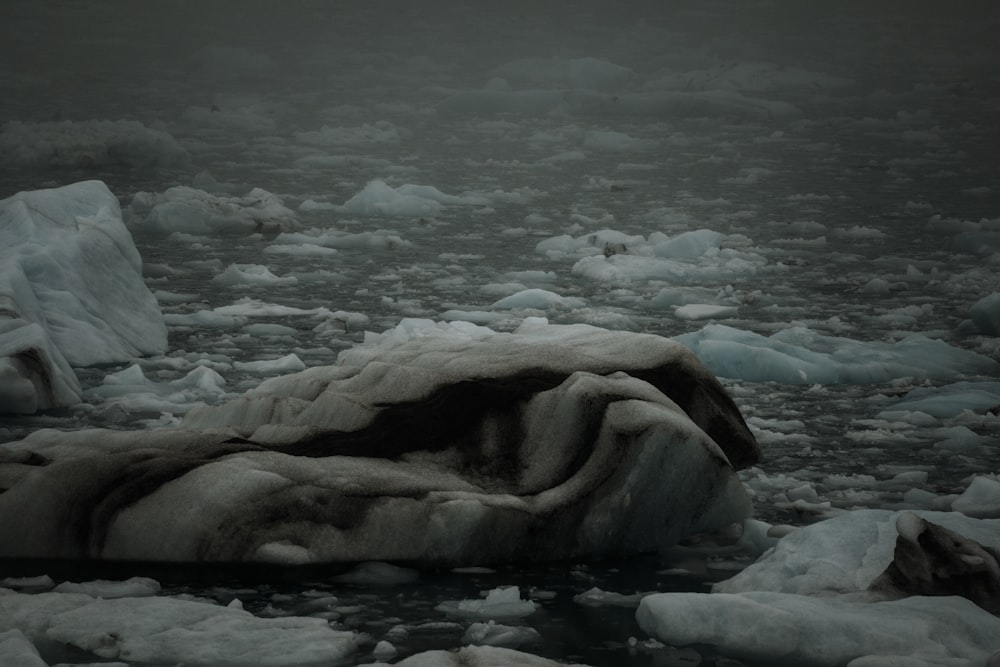 an iceberg in the middle of a body of water