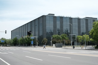 a large building sitting on the side of a road