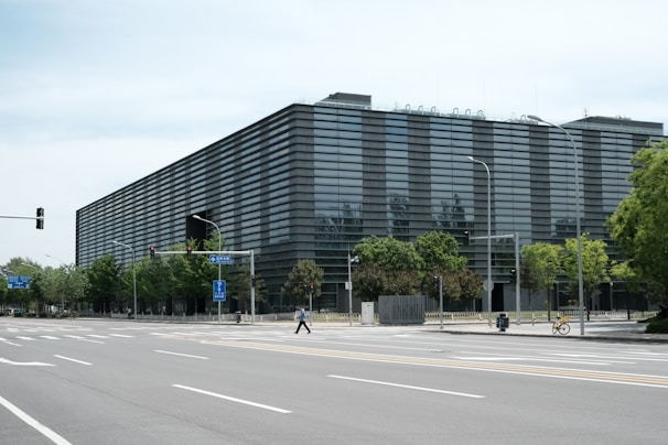 a large building sitting on the side of a road
