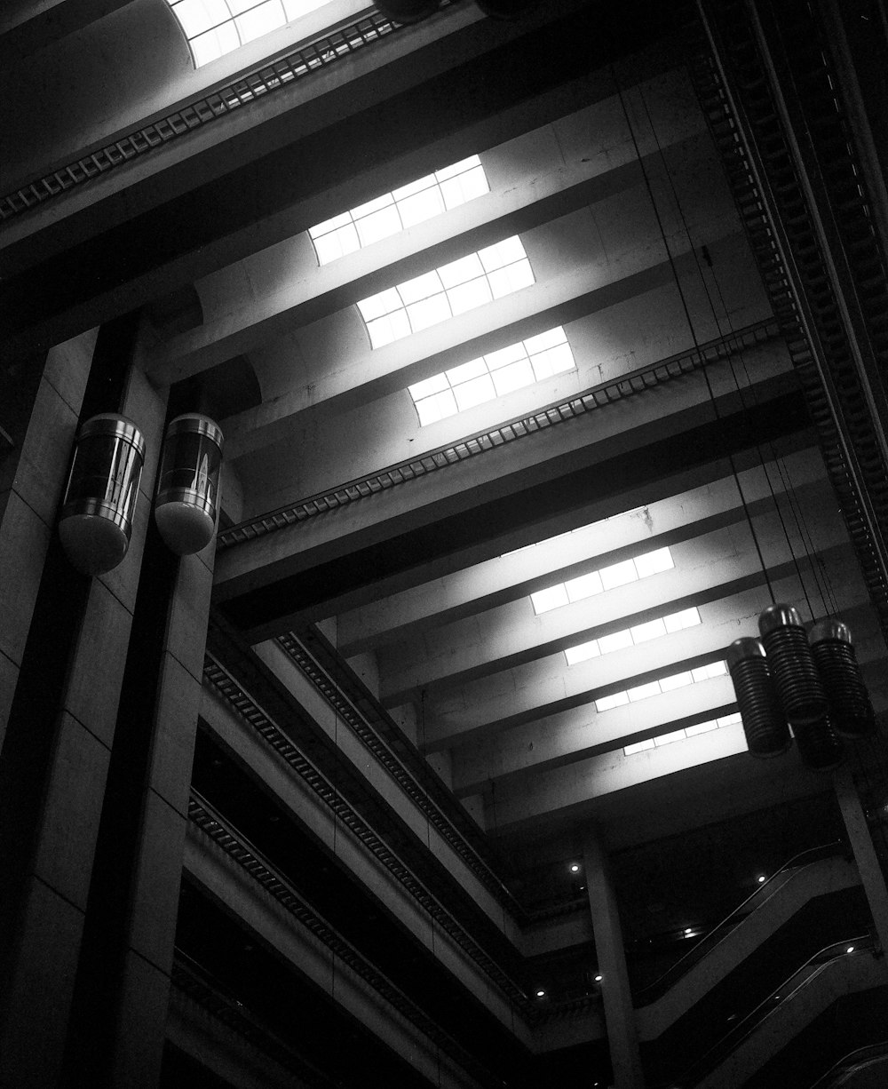 a black and white photo of the ceiling of a building