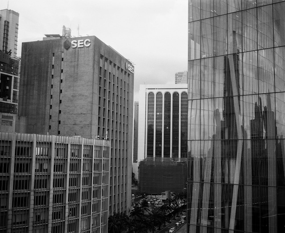 a black and white photo of a city with tall buildings