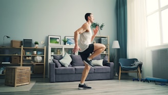 a man is dancing in a living room