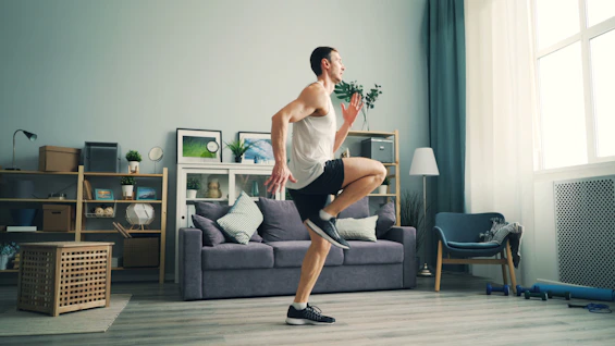 a man is dancing in a living room