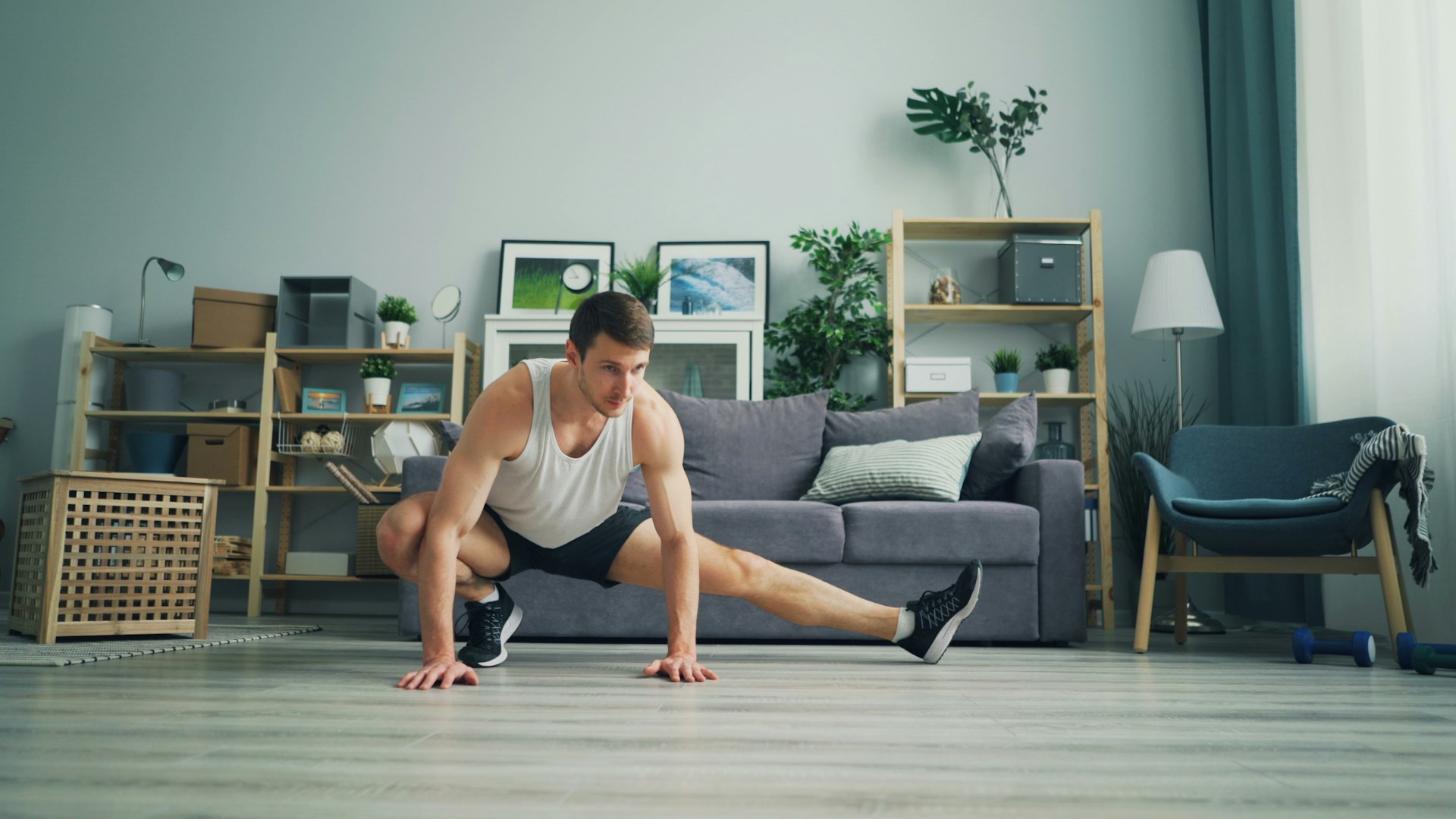 a man sitting on the floor in front of a couch