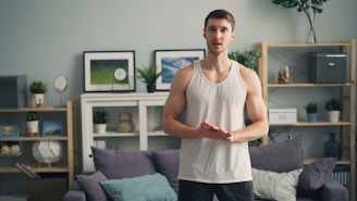 a man standing in front of a couch in a living room