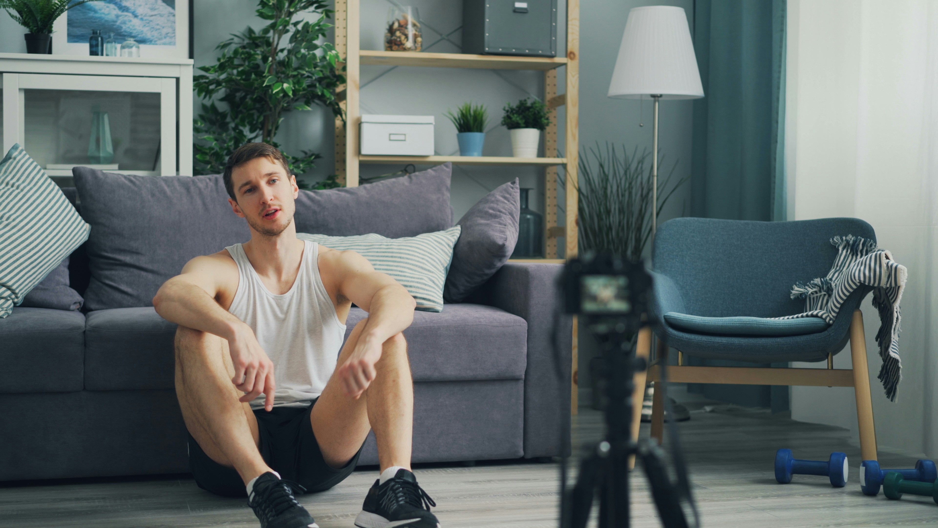 a man sitting on a couch in a living room