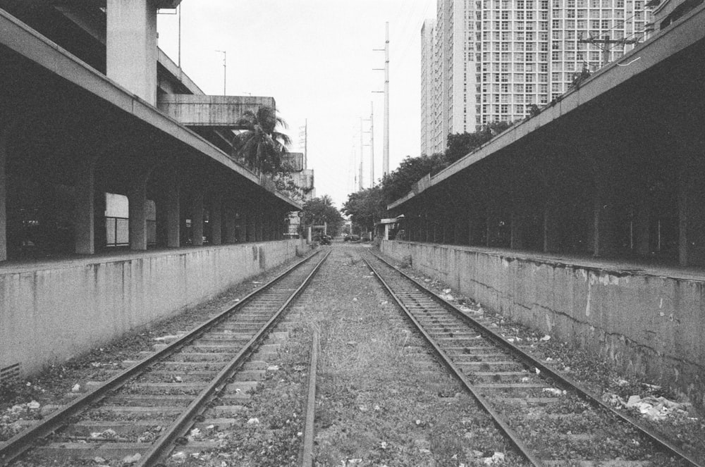 a black and white photo of a train track