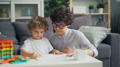 a woman and a child are sitting at a table