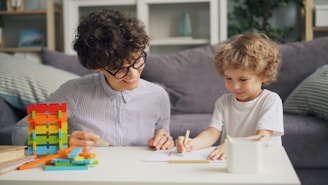 a woman and a child sitting at a table