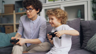 a man and a child playing a video game
