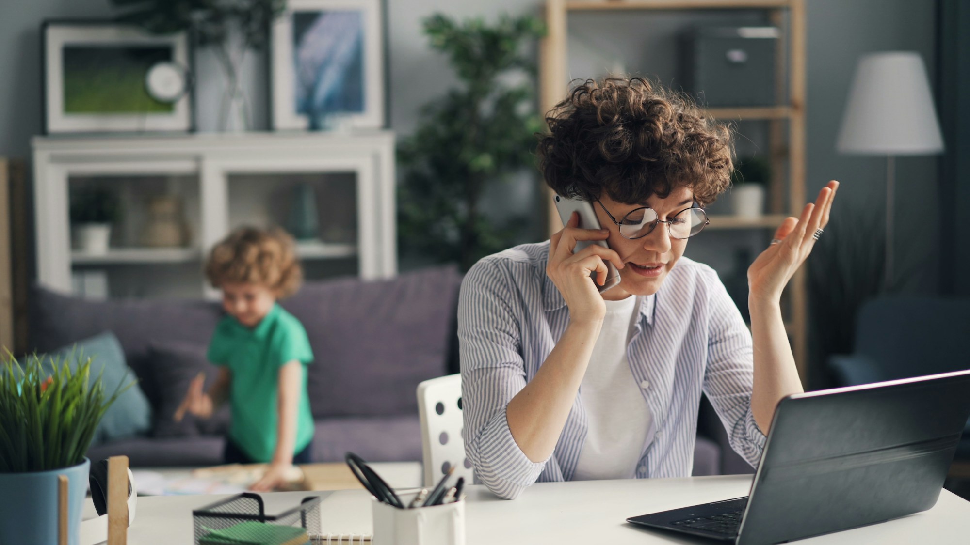 Woman coordinating plans on the phone at a table