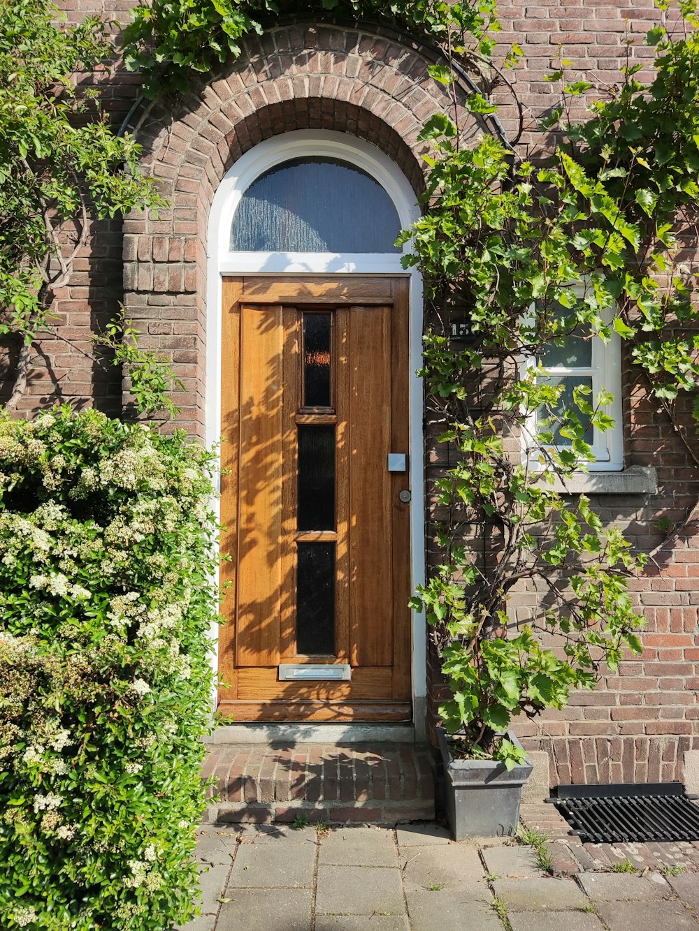 a wooden door in front of a brick building