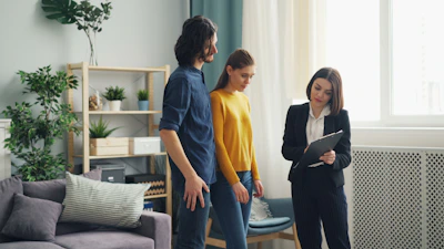 a man and a woman standing in a living room