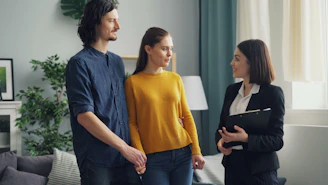 a group of people standing in a living room