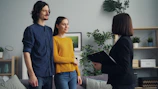 a man and a woman standing in a living room