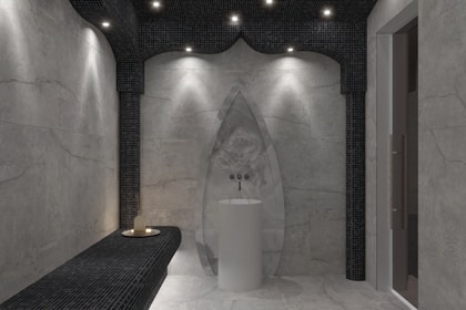 a bathroom with a white tub and a black counter