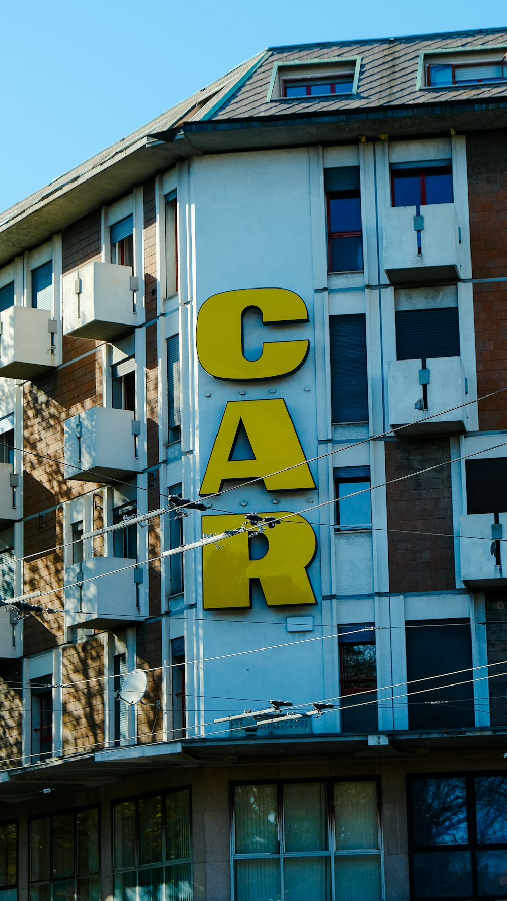 a building with a car sign on the side of it