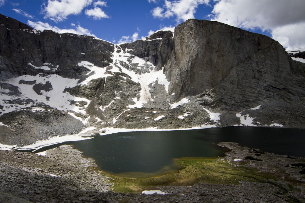 a mountain with a lake in the middle of it