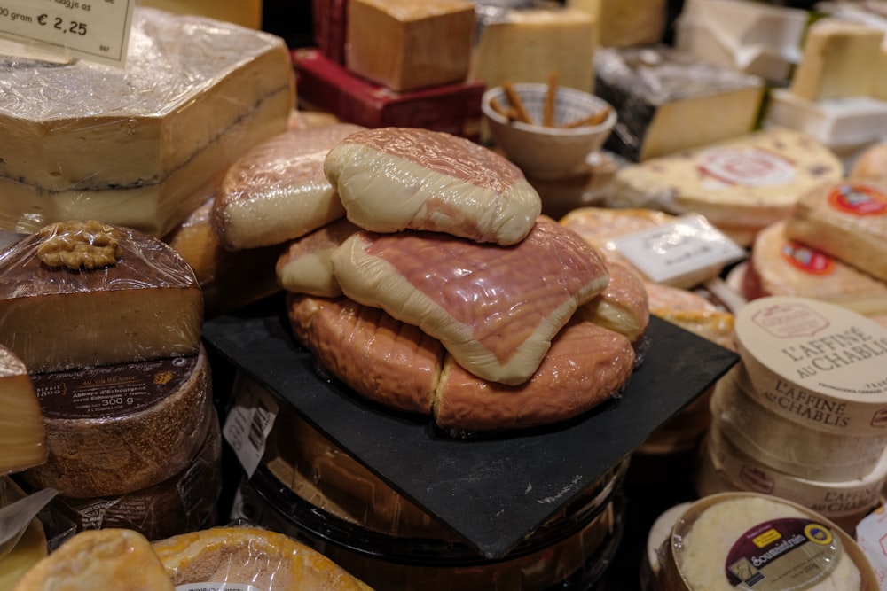 a table topped with lots of different types of cheese