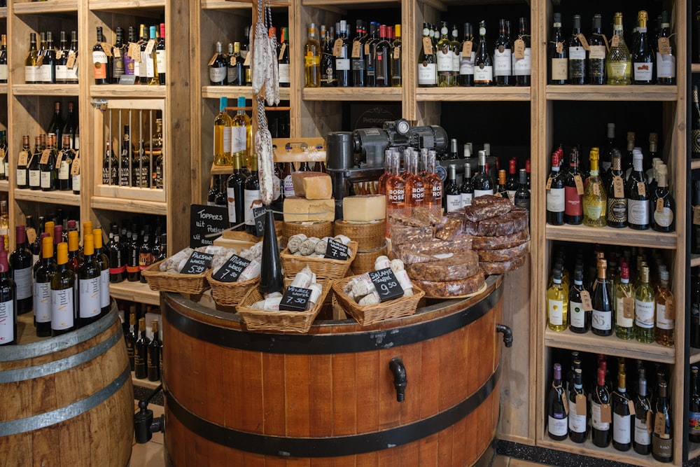 a wooden barrel filled with lots of bottles of wine