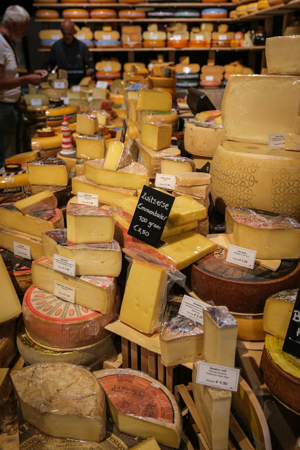 a bunch of cheeses that are on a table