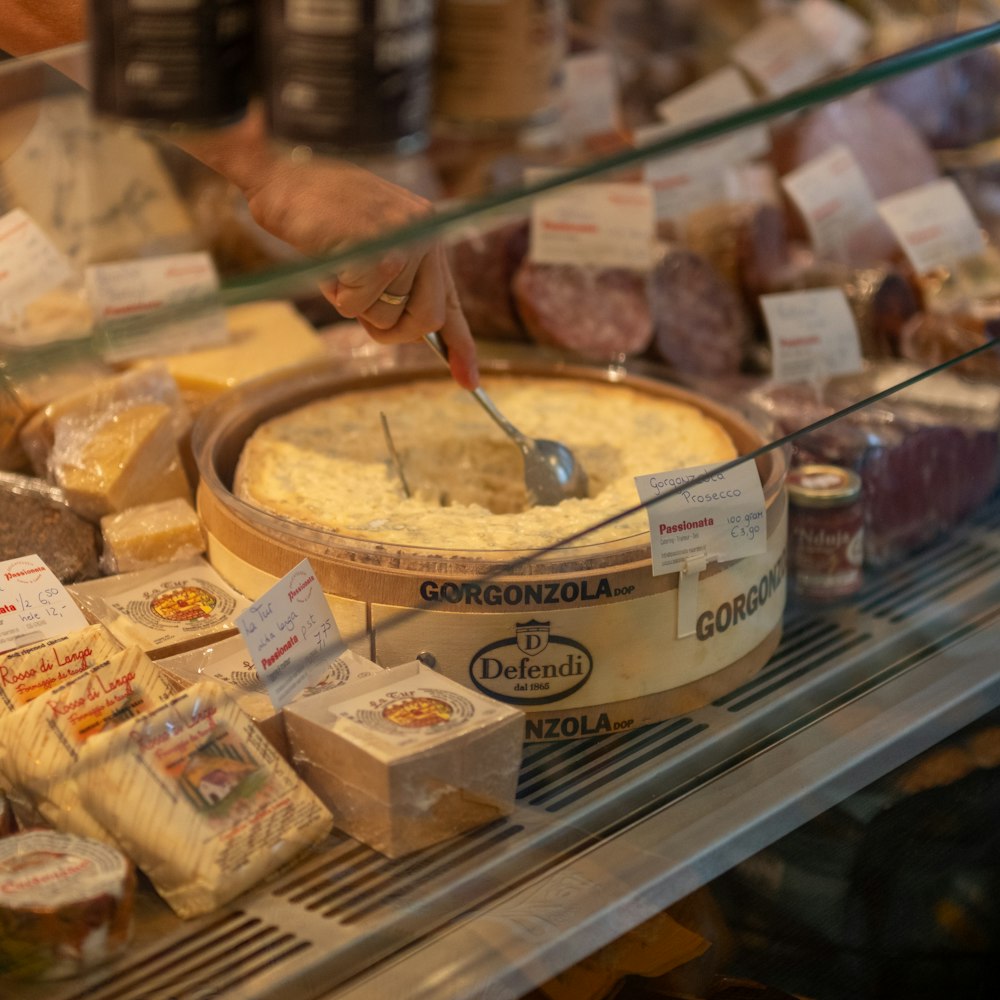 a display case filled with lots of different types of food