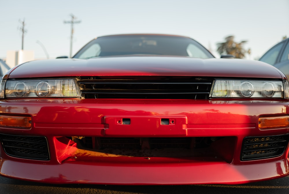 a red sports car parked in a parking lot