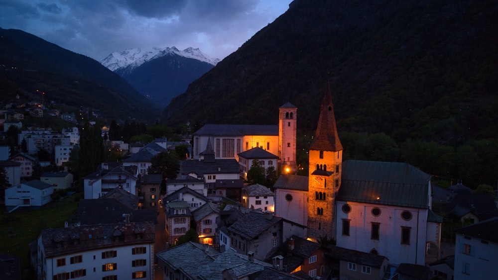 a town with a church lit up at night