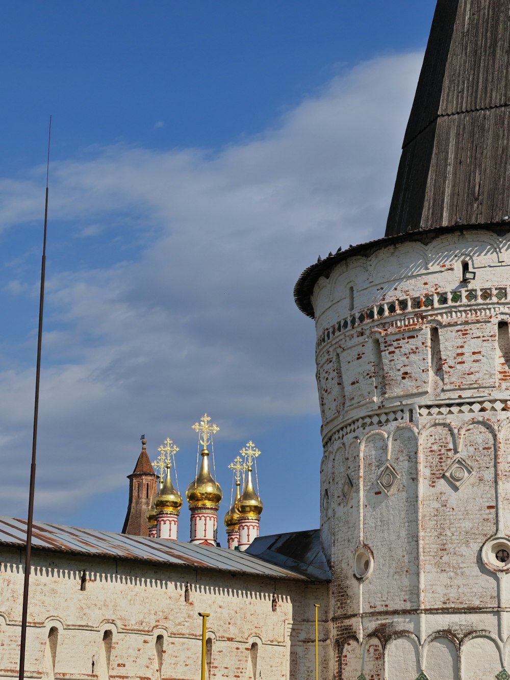 a tall tower with a clock on it's side