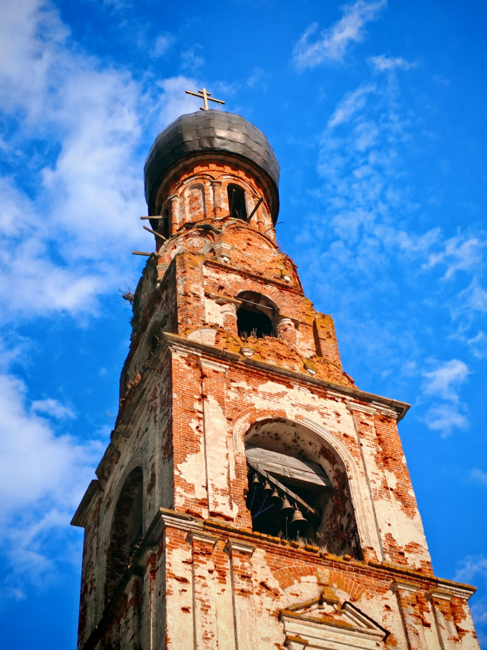 a very tall tower with a clock on it's side