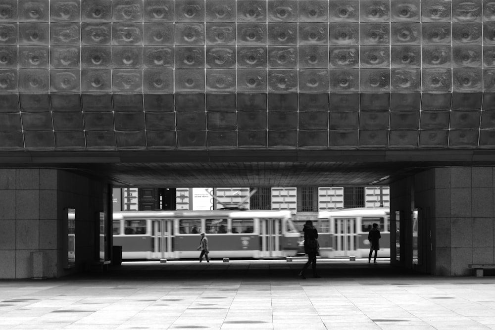 a black and white photo of a subway station