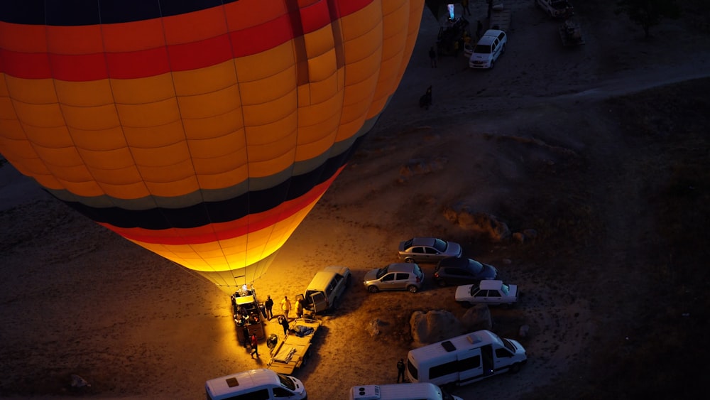 a large hot air balloon being lifted by a crane
