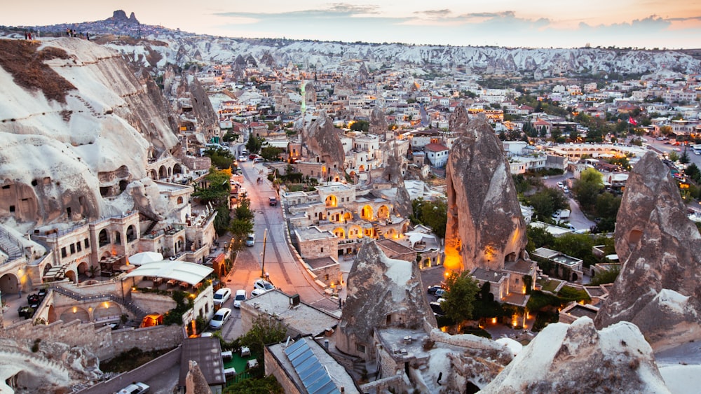 an aerial view of a city in the mountains